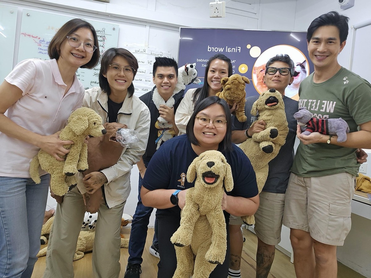 A Canine First Responder class smiling with their training dogs